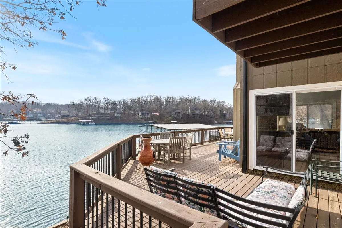 A spacious lakeside deck furnished with comfortable seating, decorative pottery, and open views of the water. The deck is set up for both relaxation and gatherings, offering a tranquil spot to enjoy sunrise coffee or evening stargazing, while being just steps away from the lake.